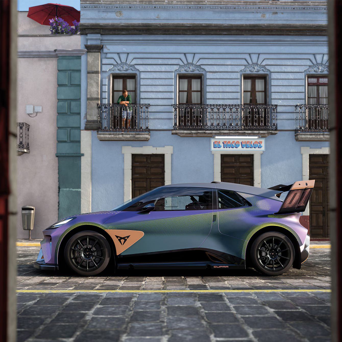 CUPRA Urban Rebel modell kék társasházi épület előtt