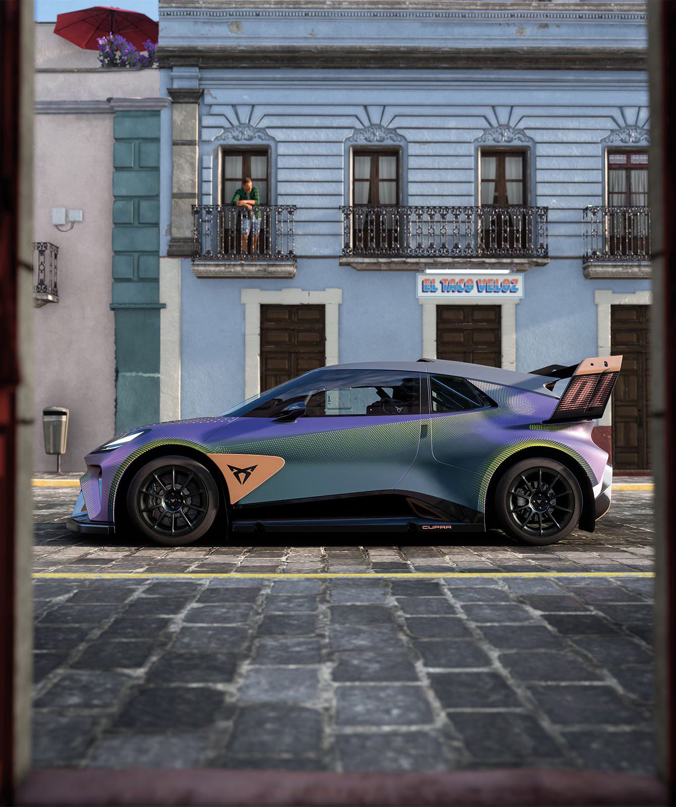 CUPRA Urban Rebel modell kék társasházi épület előtt